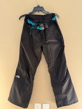 The North Face women’s  Black Snow Pants with Teal Belt Accent